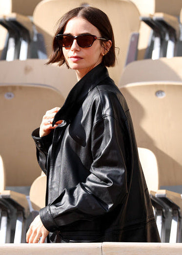 lily collins wears auter leather drawstring jacket