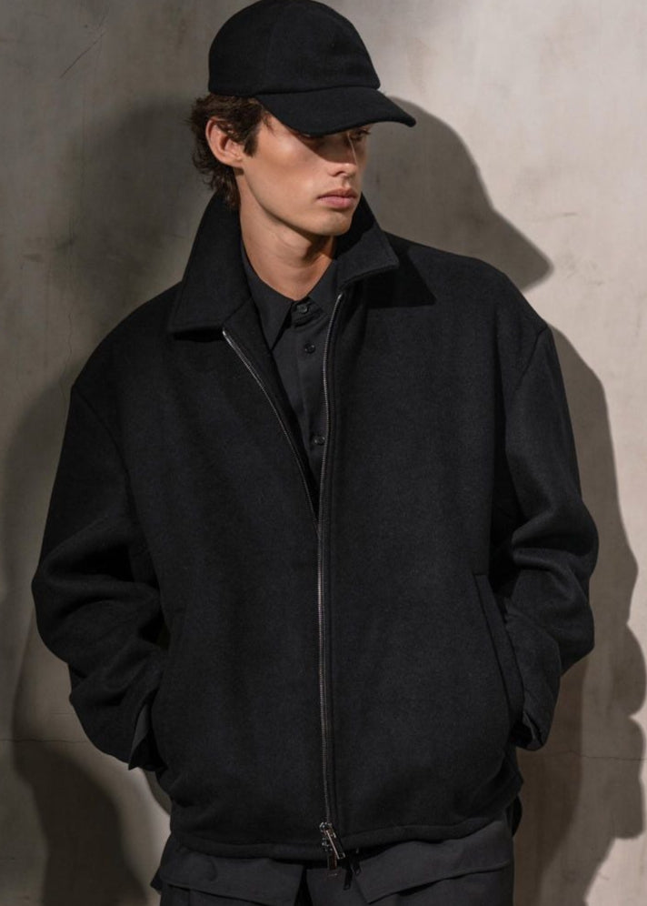 Man wearing an AUTER Italian Woold Zip jacket and AUTER baseball cap